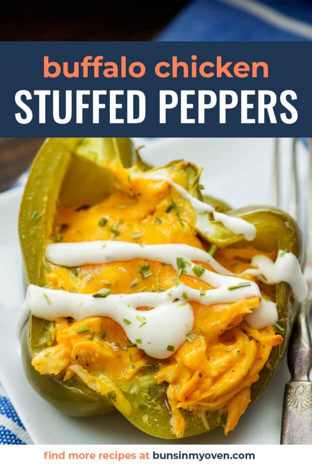Stuffed pepper on white plate with text for PInterest.
