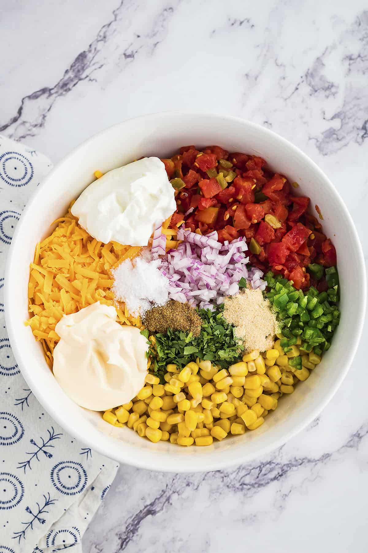 Ingredients for corn dip in mixing bowl.