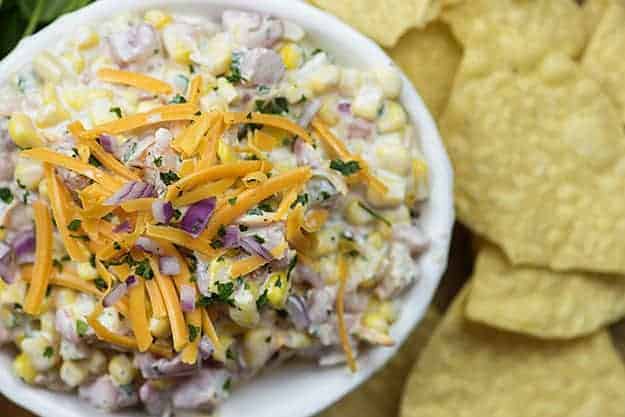 cheesy corn dip in white bowl