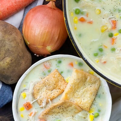 chicken pot pie soup in white bowl