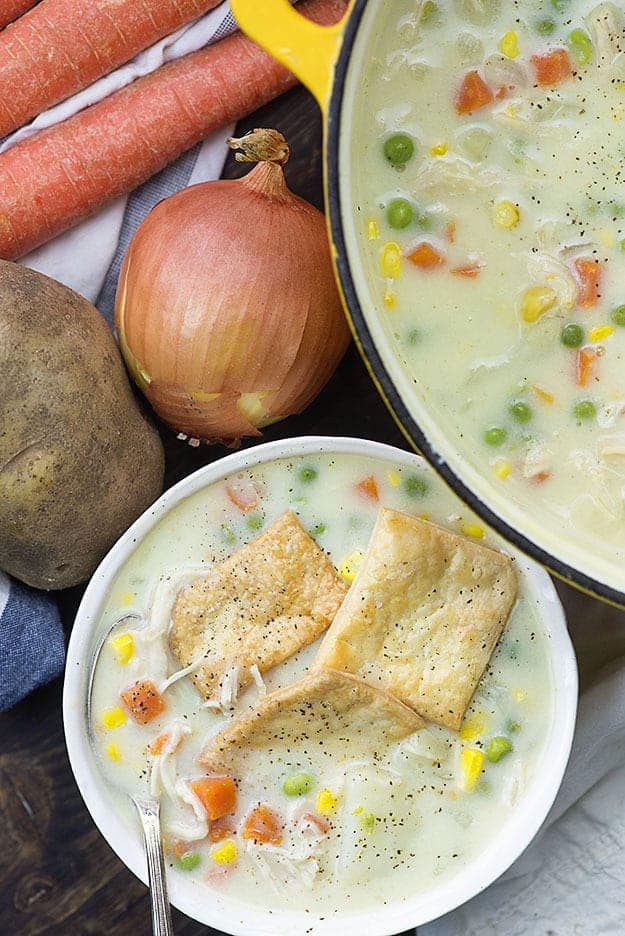 chicken pot pie soup in white bowl