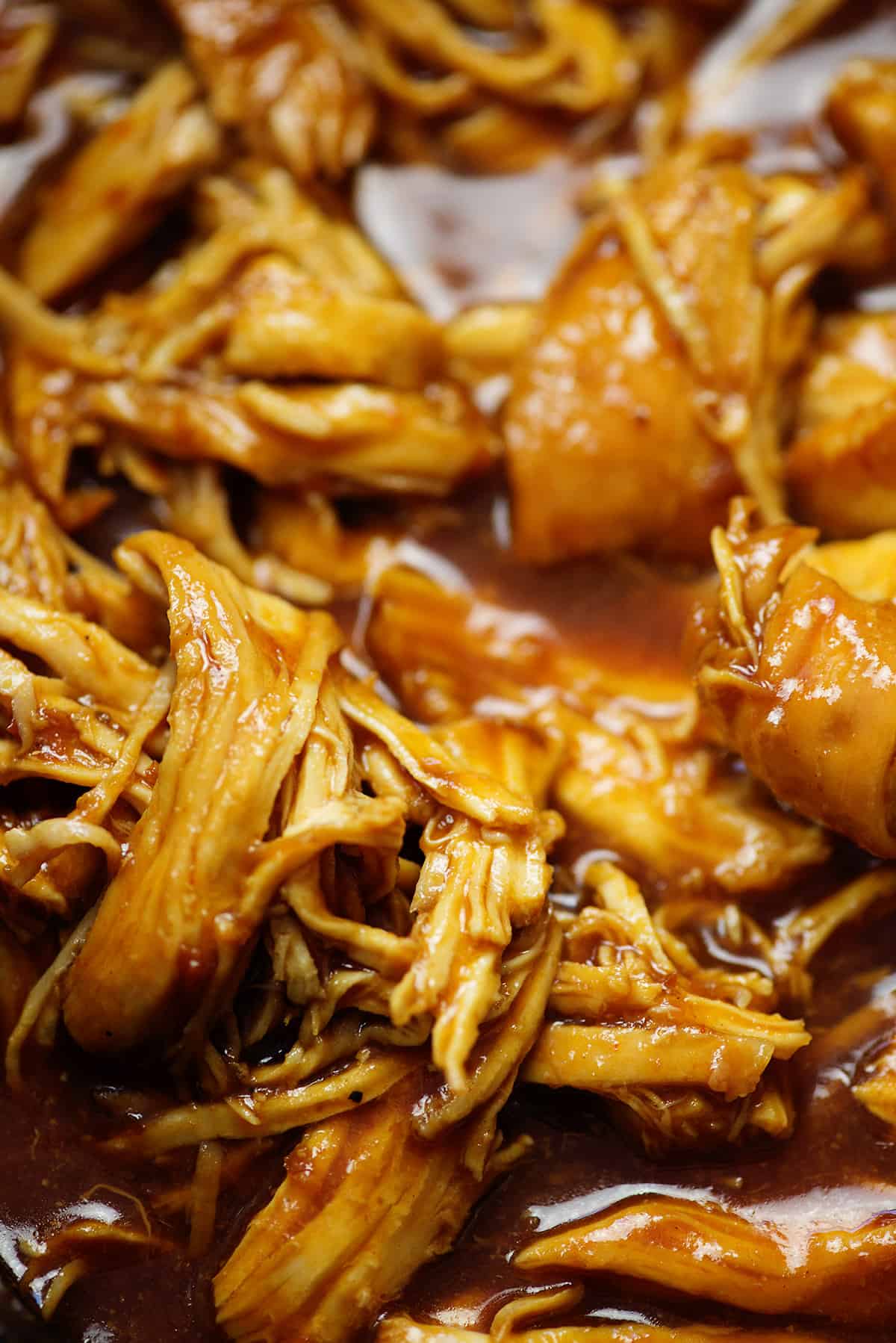 shredded BBQ chicken in crockpot.