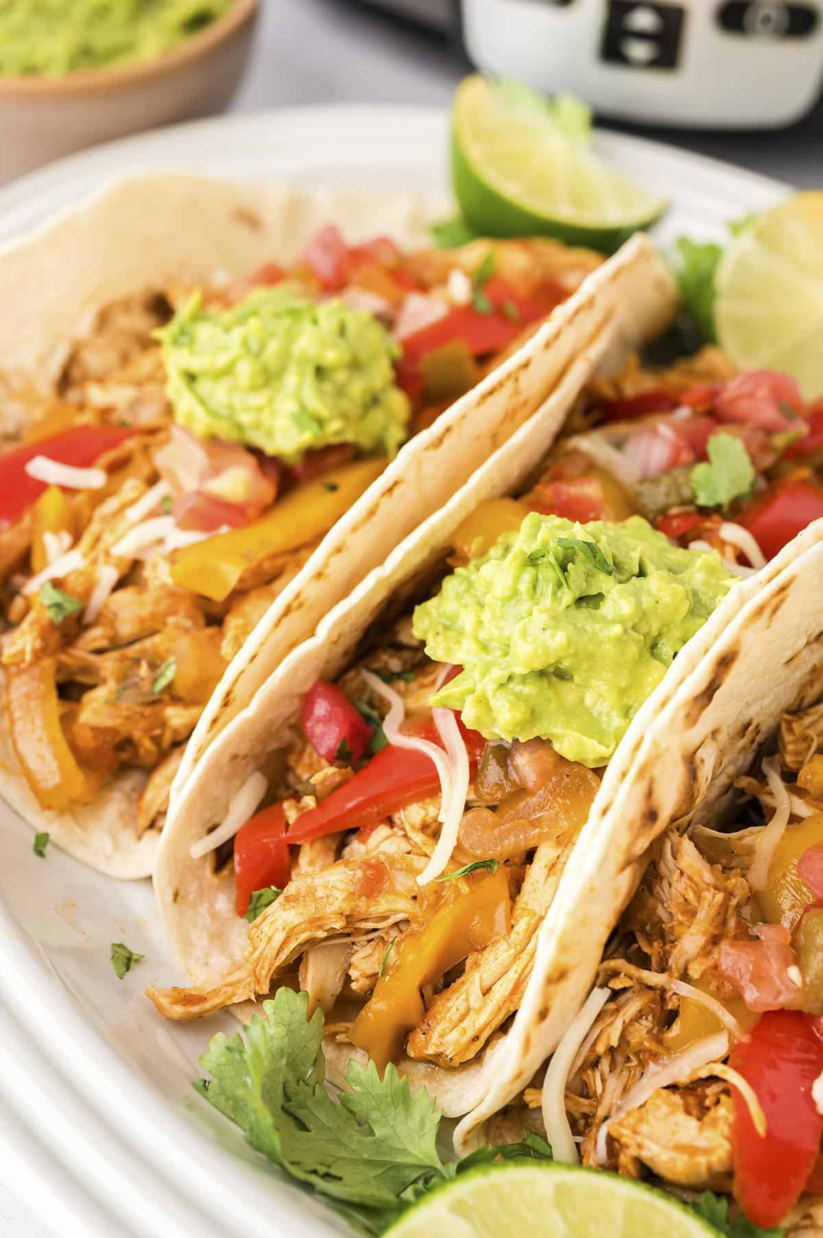 slow cooker chicken fajitas on wooden board