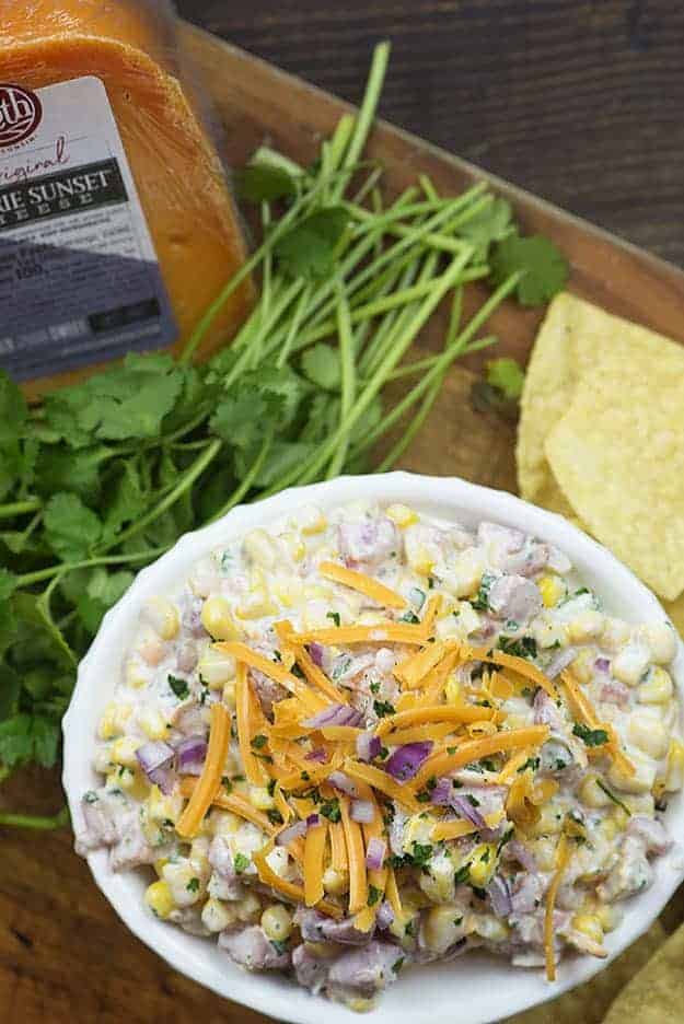 jalapeno corn dip on wooden tray