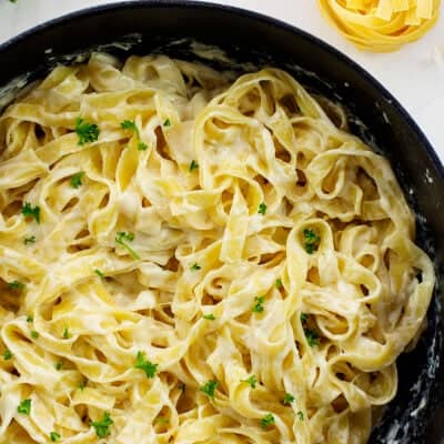 overhead view of fettucine alfredo in skillet.