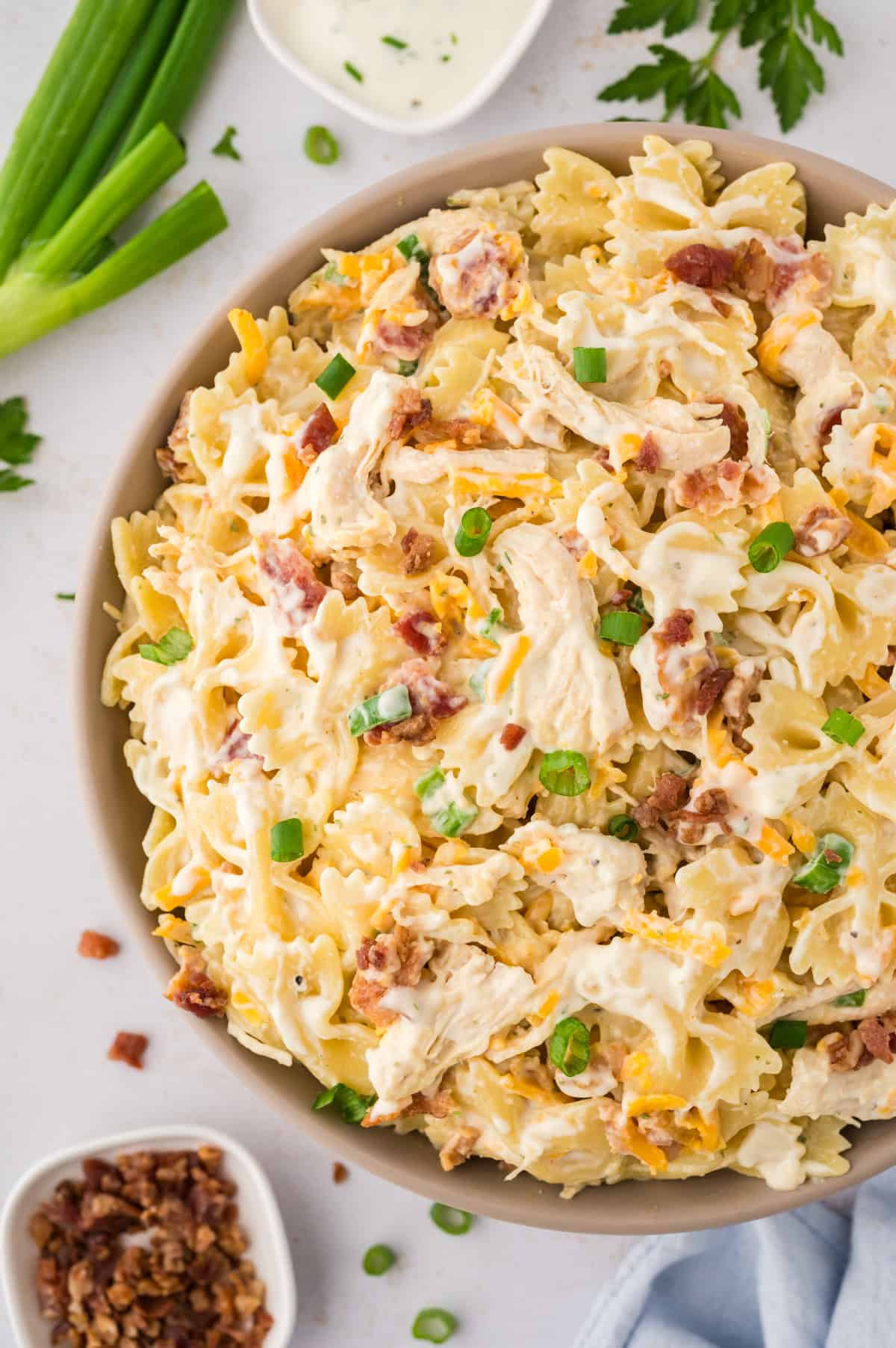 Chicken bacon ranch pasta salad in white serving dish.
