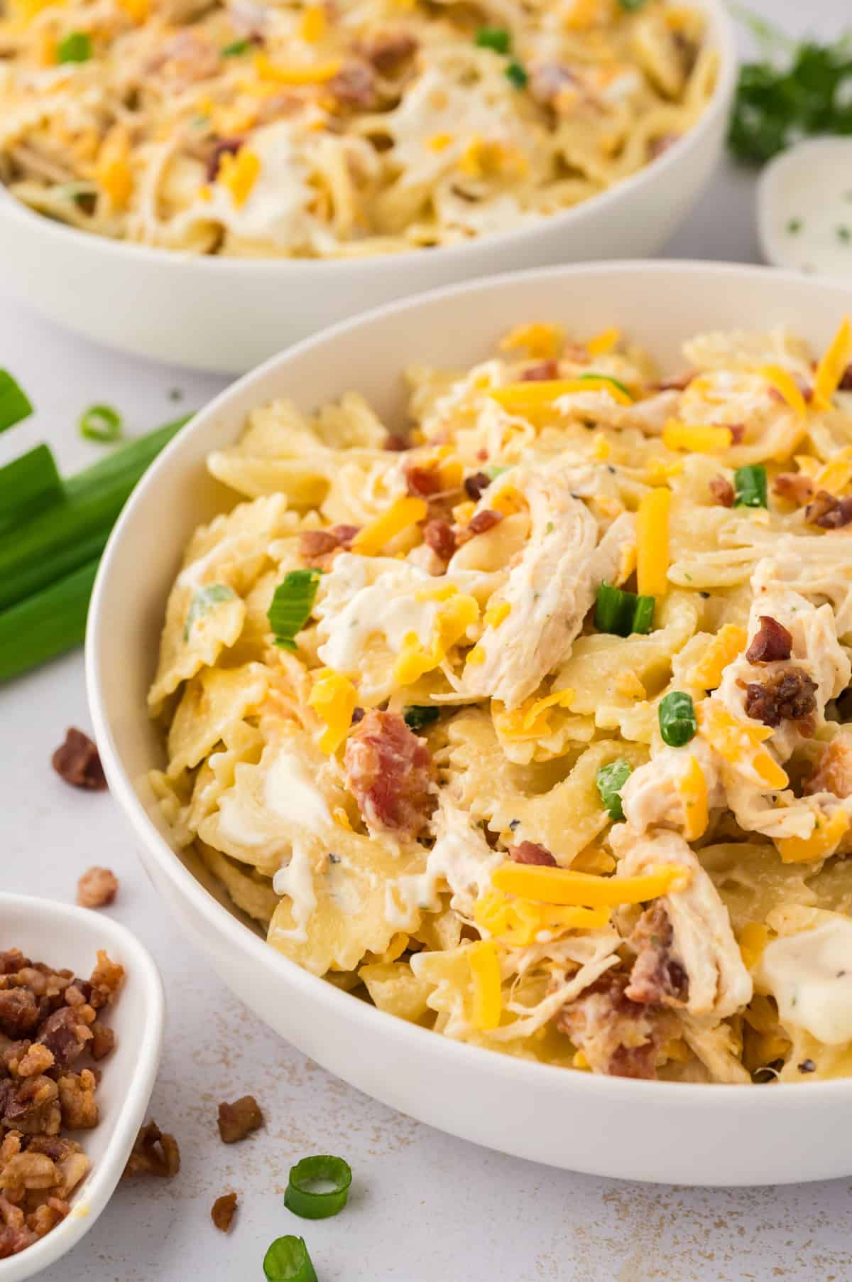 White bowl filled with chicken bacon ranch pasta salad.