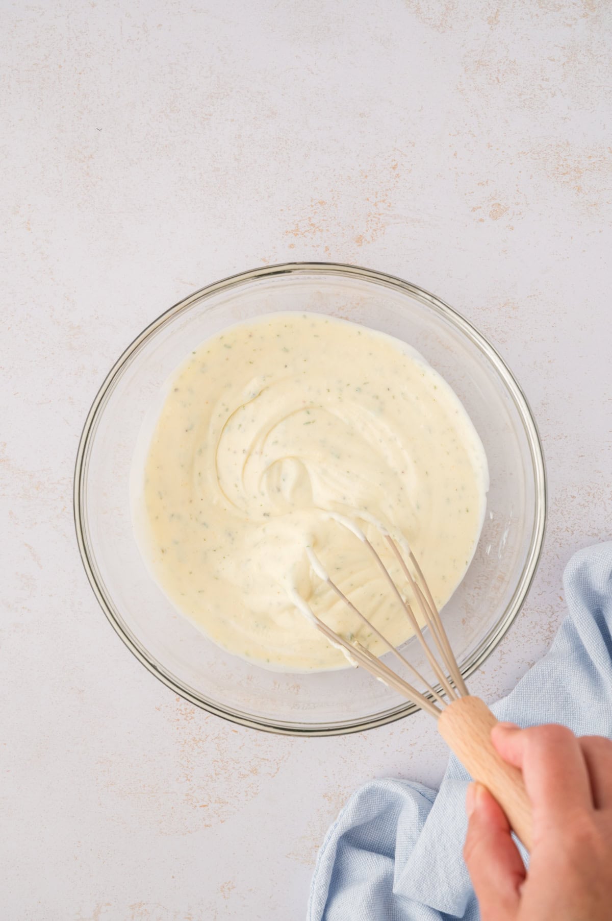 Homemade ranch dressing in mixing bowl.
