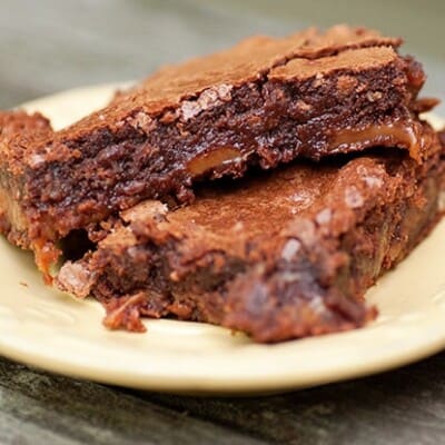 Two turtle brownies on a plate