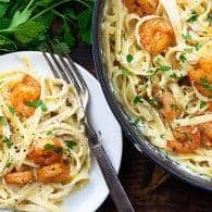 homemade alfredo with shrimp in white dish