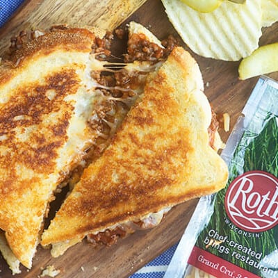 sloppy joe grilled cheese on wooden cutting board