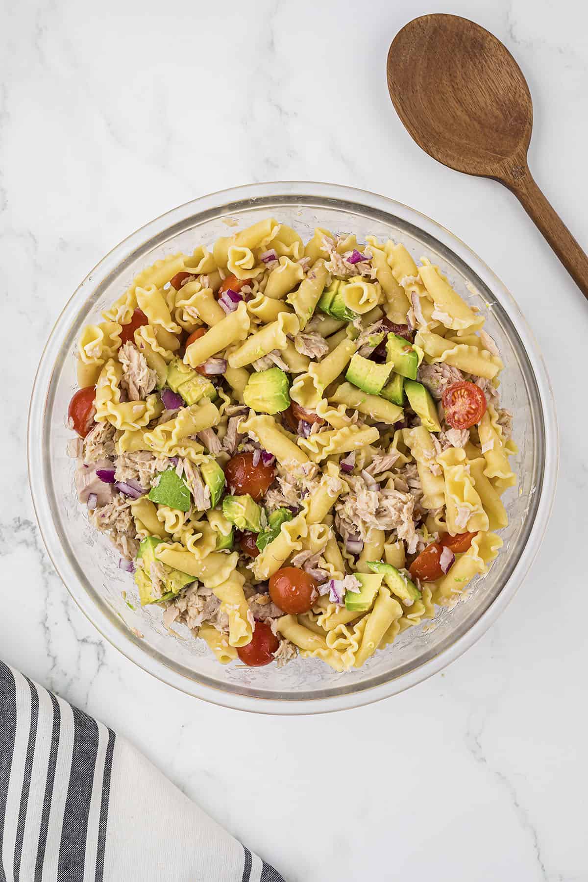 Tuna and vegetables in bowl of pasta.