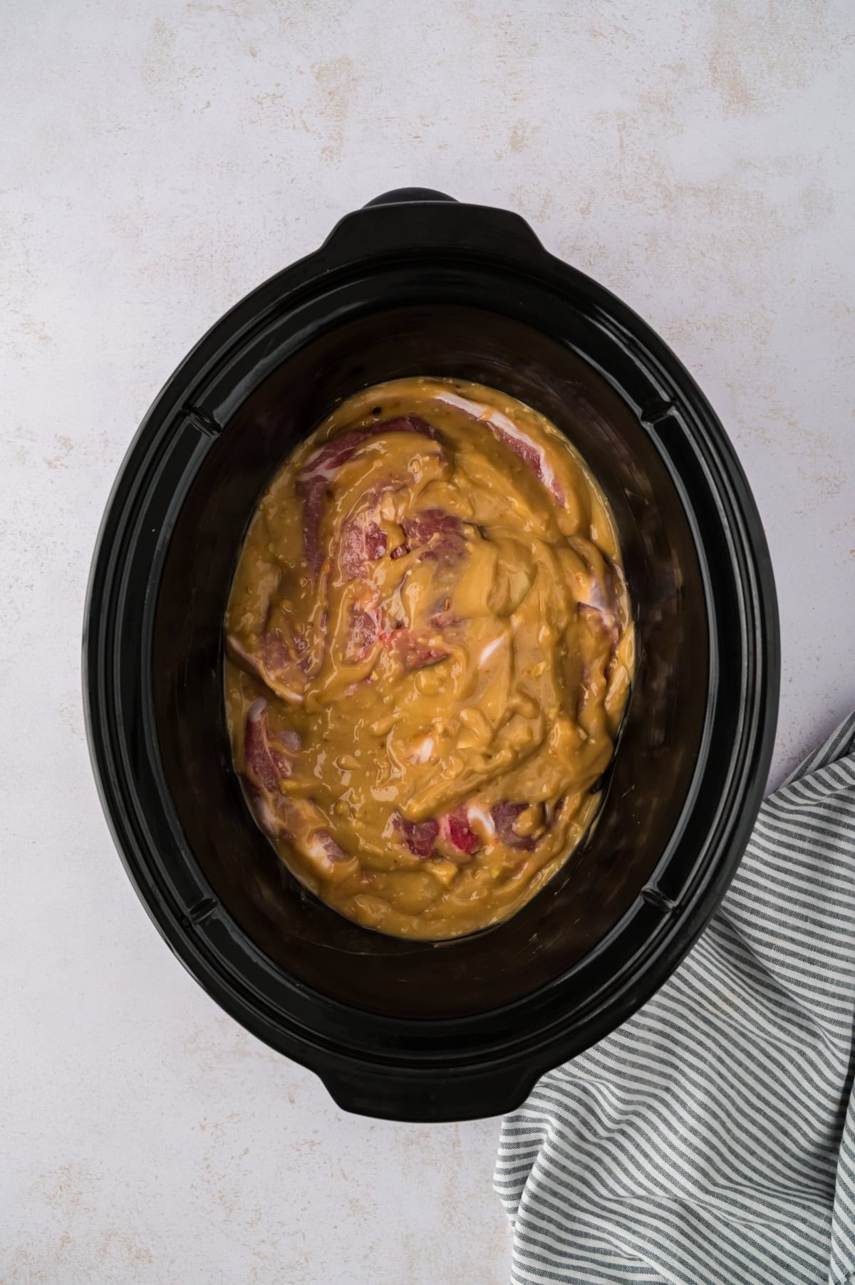 Crockpot full of smothered pork chops.