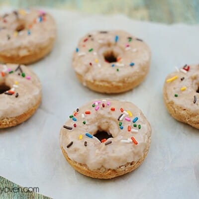 A close up of a doughnut topped with sprinkles