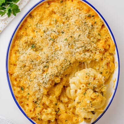 baked mac and cheese casserole in white baking dish.