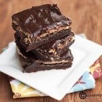A stack of buckeye brownies on a folded cloth napkin