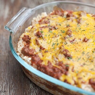 A cheesy rice bake in a clear glass pan