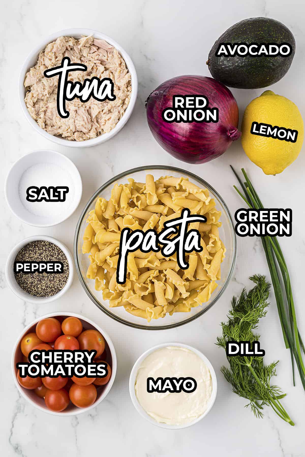 Ingredients for tuna pasta salad laid out on countertop.