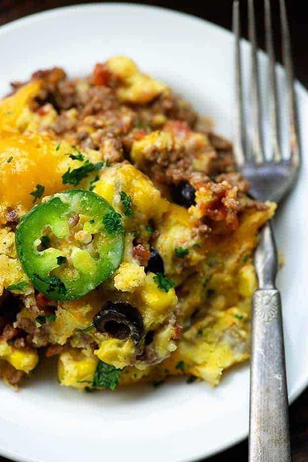 A fork on a plate of taco casserole.