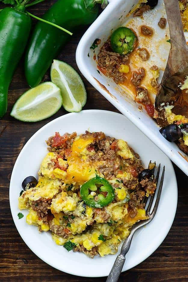 taco cornbread casserole on a plate near a baking pan.