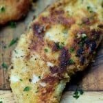 parmesan crusted chicken on cutting board
