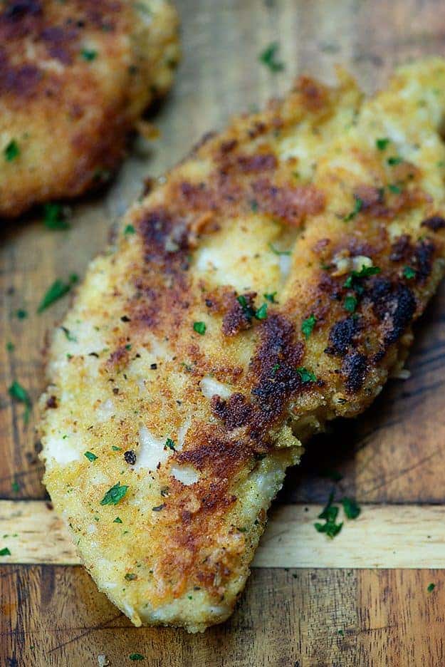 parmesan crusted chicken on cutting board