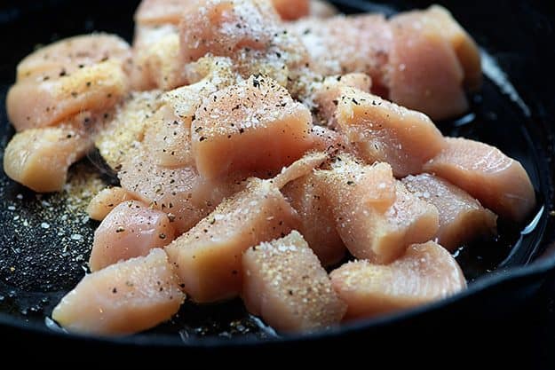 seasoned chicken in cast iron skillet