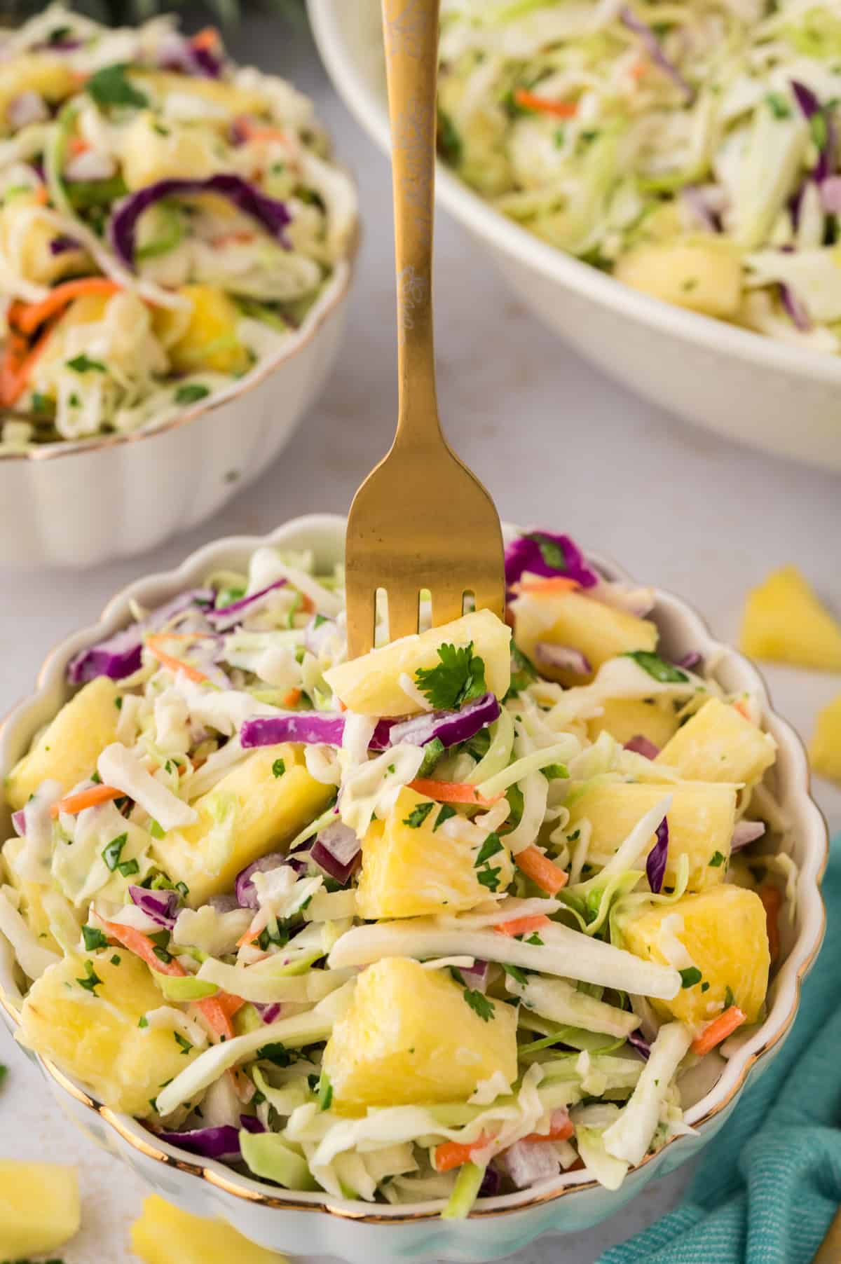 Bowl full of pineapple coleslaw.