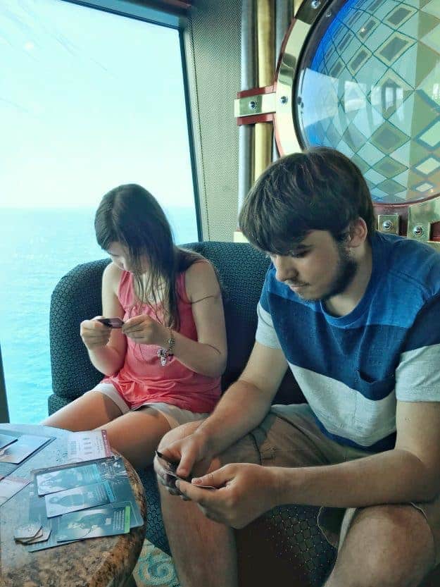 A boy and a girl playing a card game.