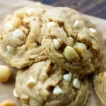 A close up of stacked macadamia nut cookies.