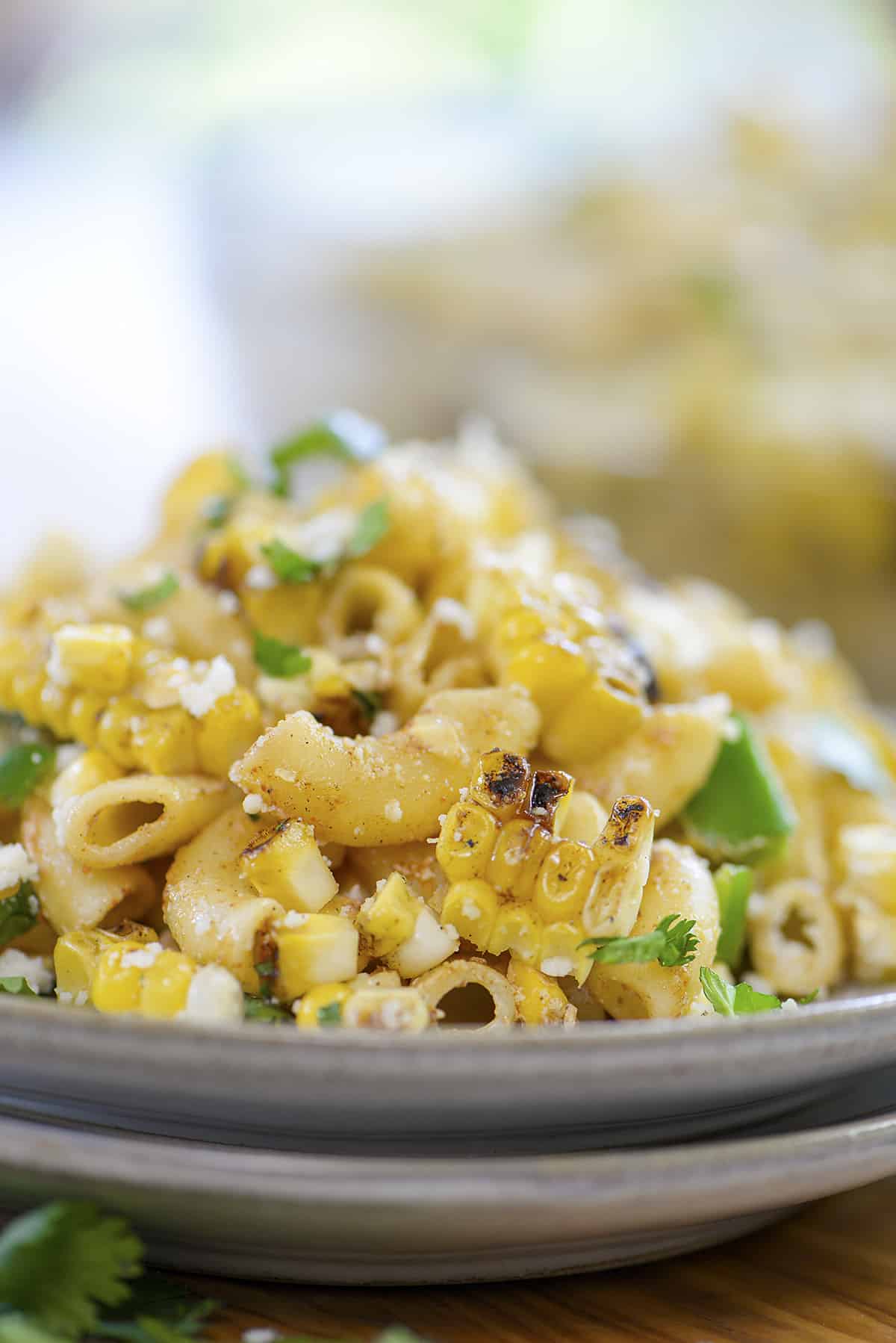 Plate full of Mexican street corn macaroni salad.