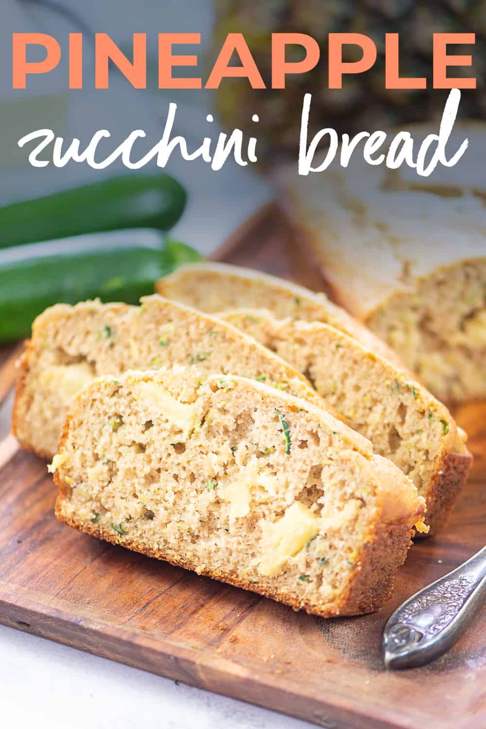 pineapple zucchini bread on wooden board.