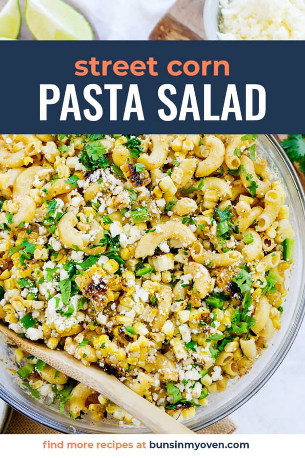Mexican pasta salad in glass bowl with text for PInterest.