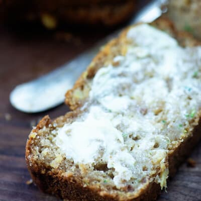 A close up of a piece of buttered bread