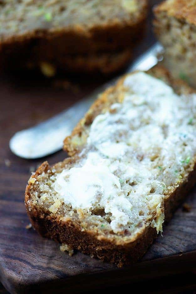 A close up of a piece of bread that has been buttered.