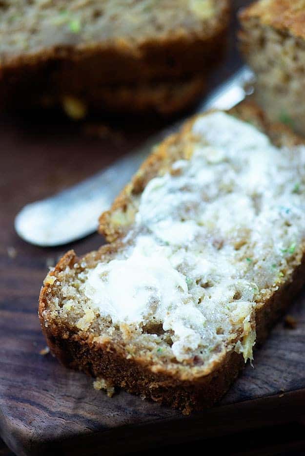 A close up of a piece of buttered bread