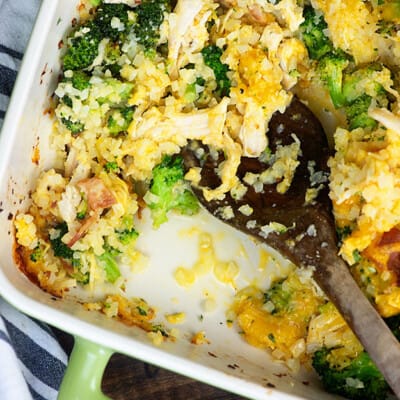 Wooden spoon in a pan of chicken casserole.