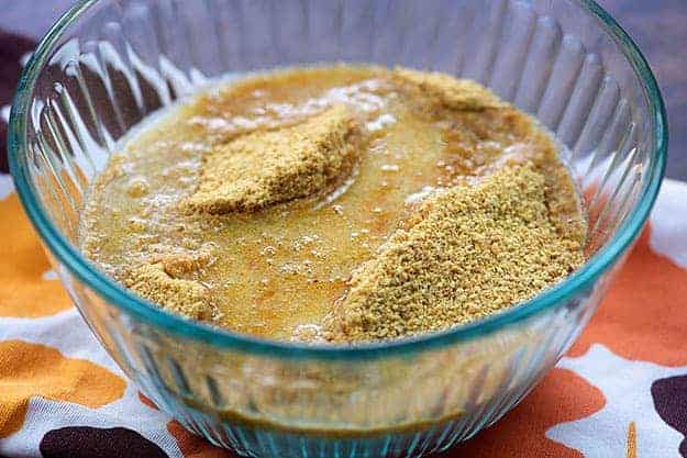 graham cracker crust ingredients in glass bowl