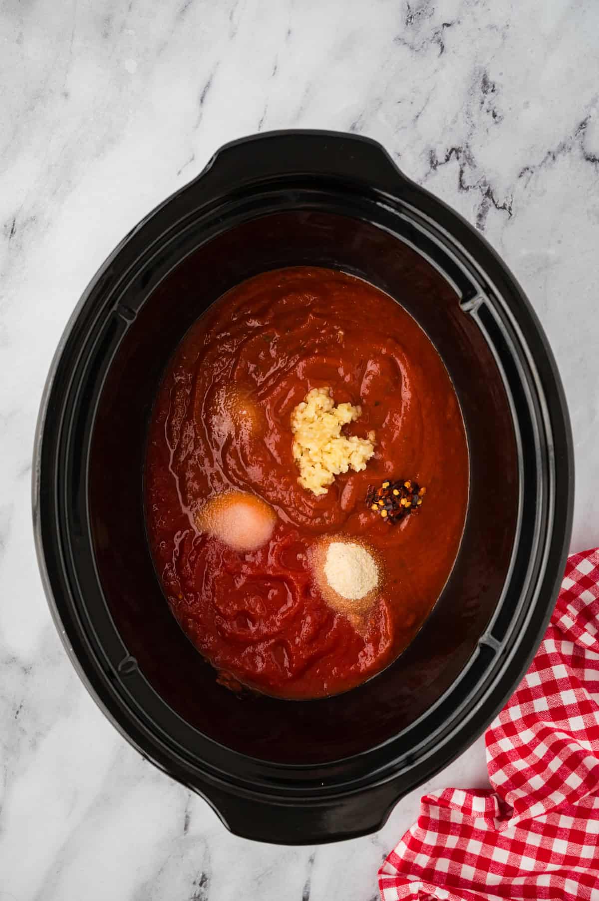 Ingredients for marinara sauce in slow cooker.