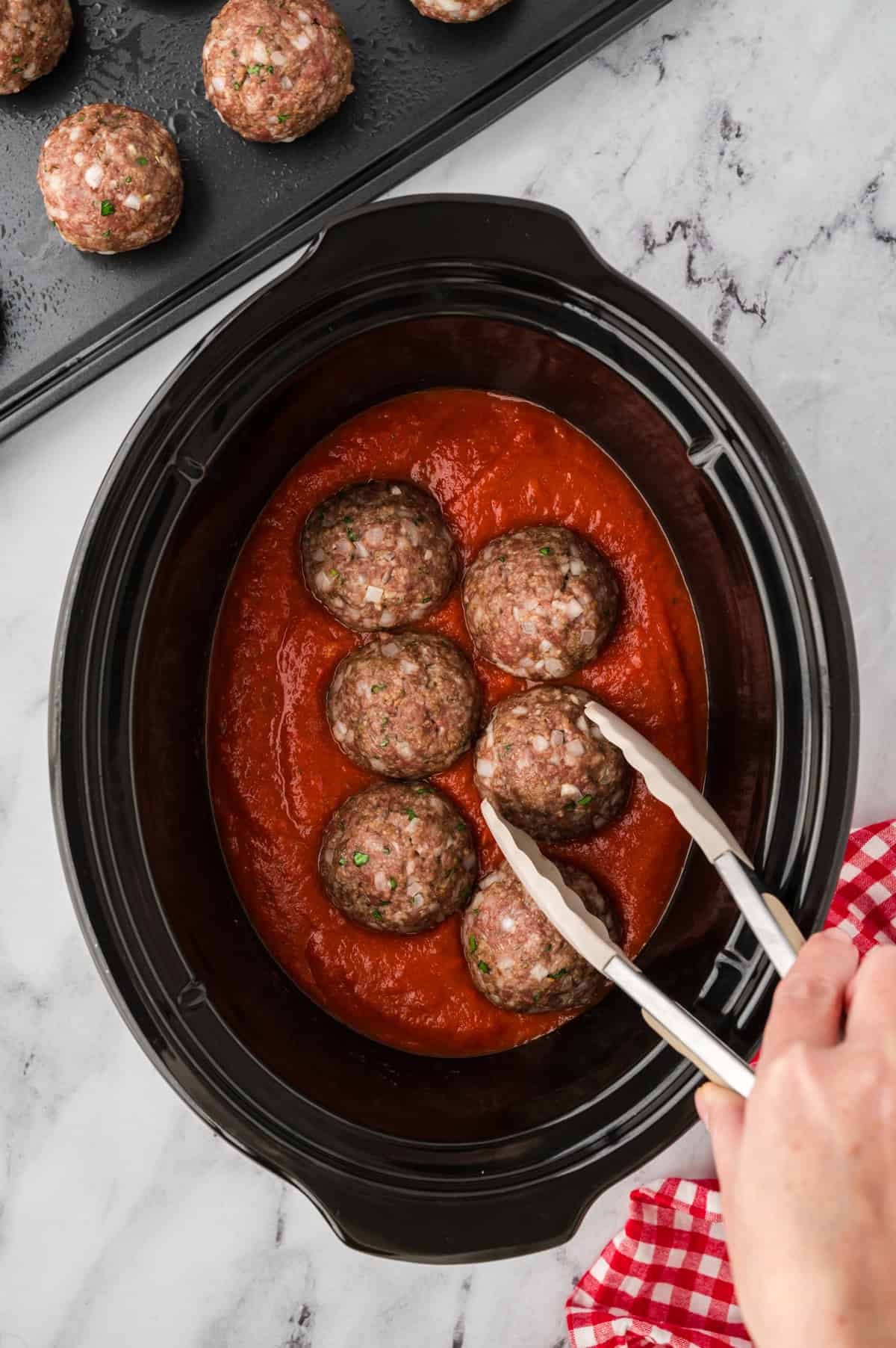 Meatballs in marinara sauce.