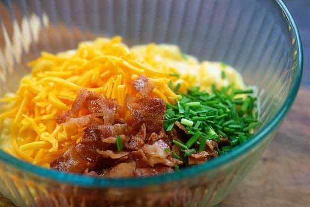 ingredients for macaroni and cheese potato skins in bowl