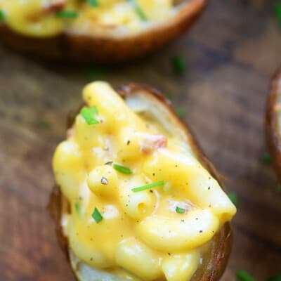 Potato halves topped with mac n cheese.