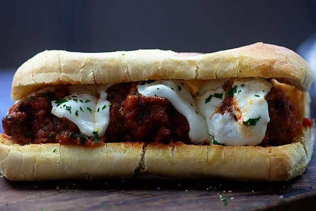 meatball sub on wooden cutting board