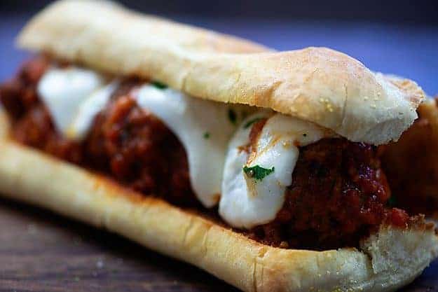 A close up of meatballs on a bun