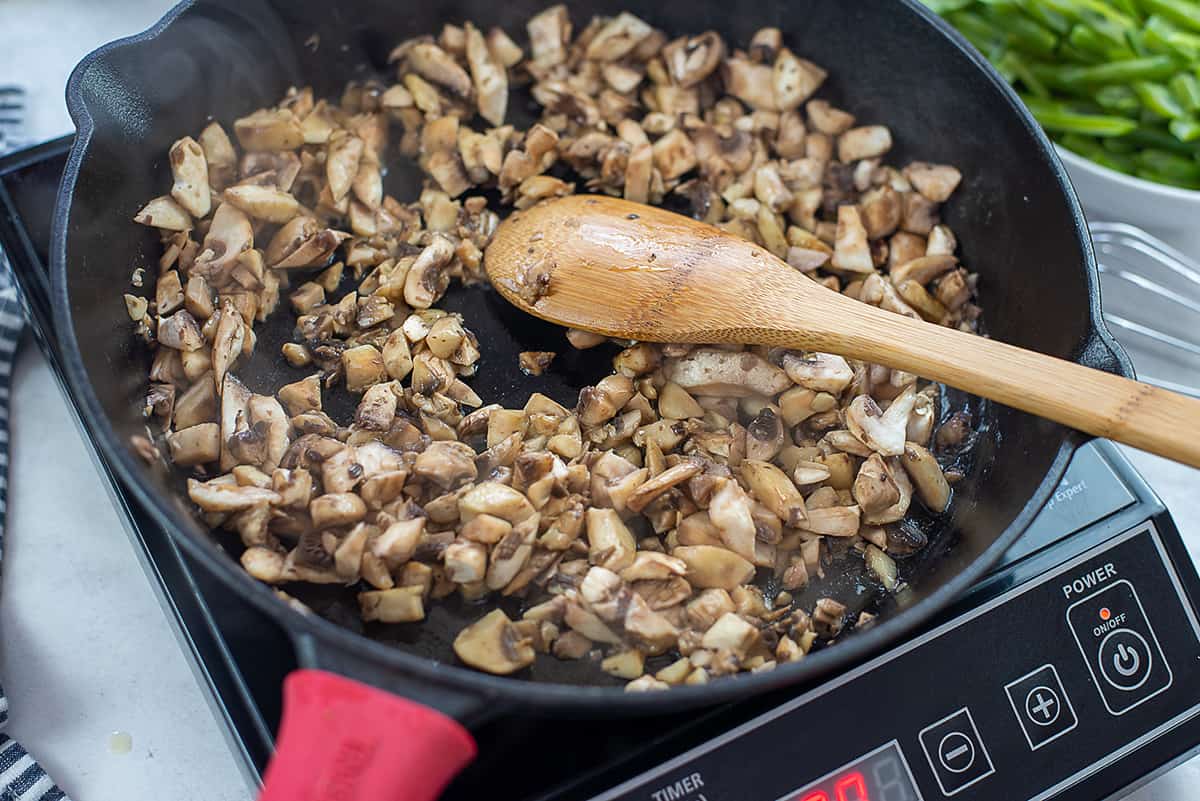 sauteed mushrooms in skillet.