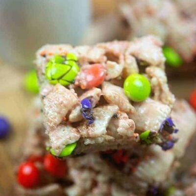 Stacked square cereal bars with m&m's.