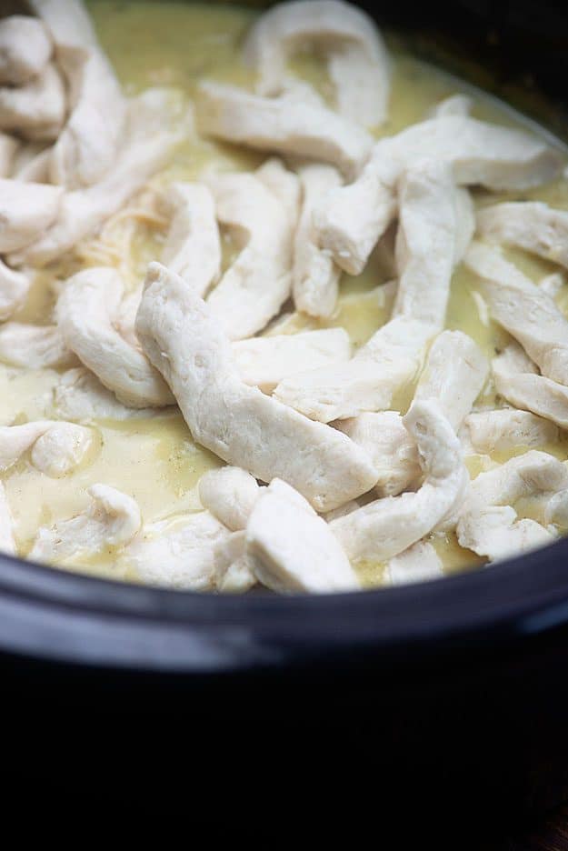 Close up of chicken in a pot.