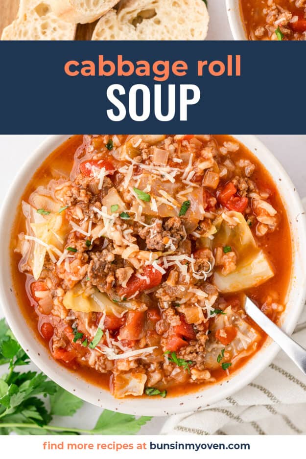 Beef cabbage roll soup in white bowl.