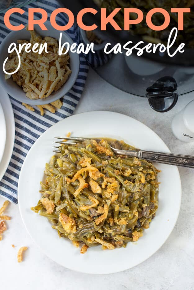 crockpot green bean casserole on plate with text for Pinterest.