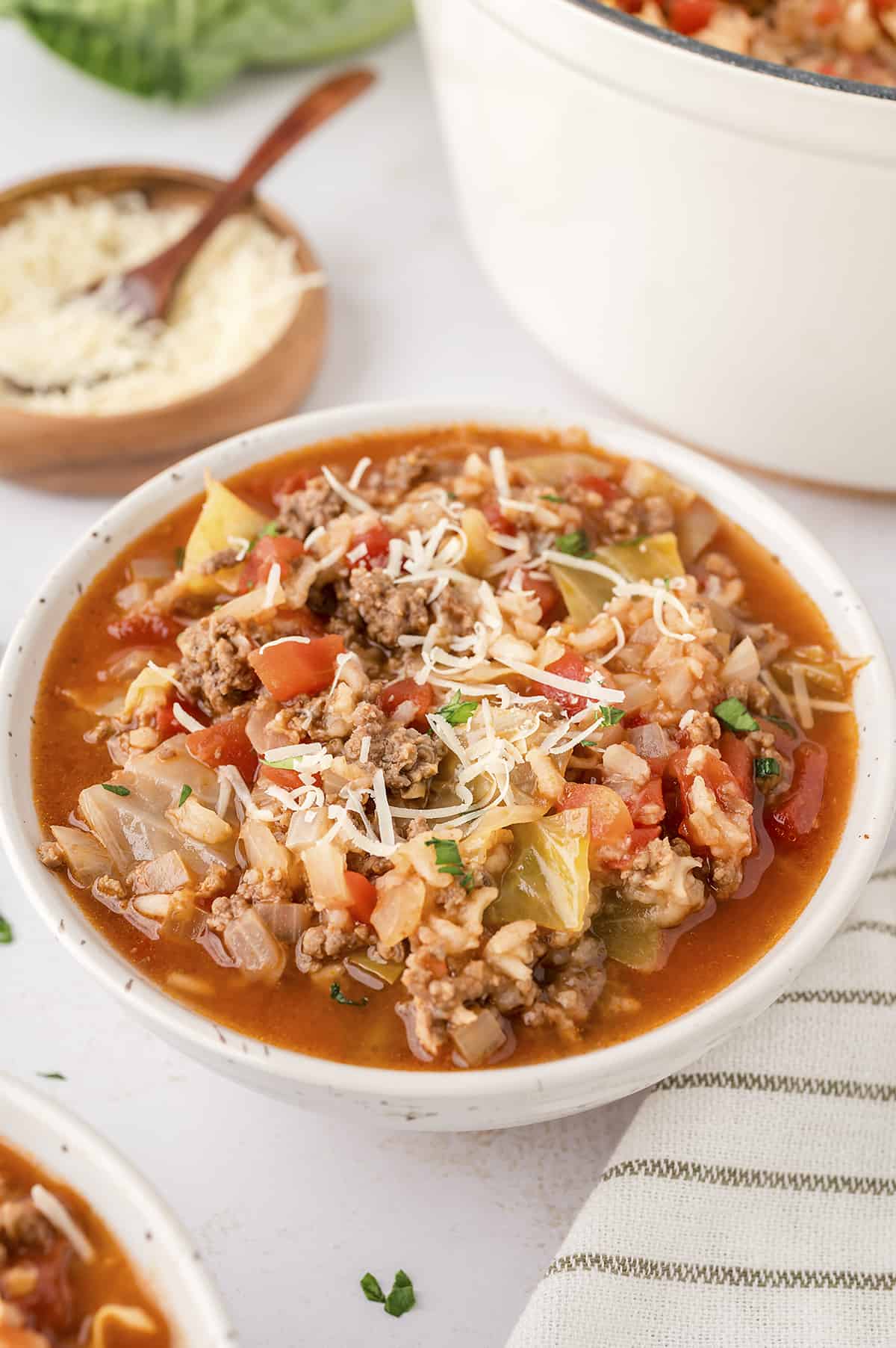 White bowl full of beef cabbage soup recipe.